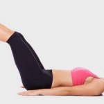 A girl performs the exercise Leg Raise